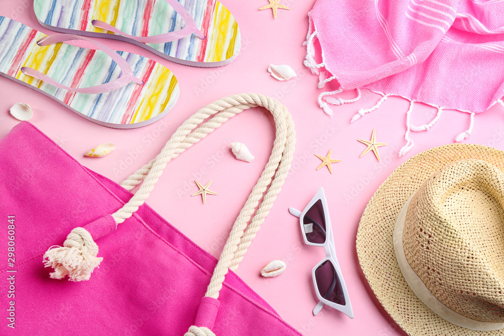 Flat lay composition with sunglasses and beach accessories on pink background Flat lay composition with sunglasses and beach accessories on pink background