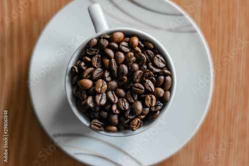 Wallpaper Mural white cup full of coffee beans top view closeup Torontodigital.ca