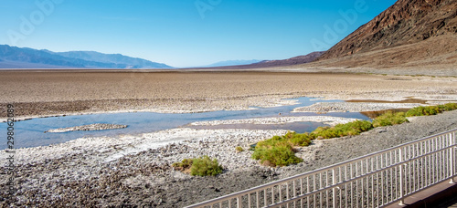 View of Death Valley landscape, rock formations and the badwater basin salt deposits. photo
