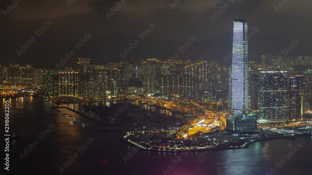 Timelapse Hong Kong Yau Tsim Mong district skyscraper with white flashing advertisement illumination near harbour at night zoom out Timelapse Hong Kong Yau Tsim Mong district skyscraper with white flashing advertisement illumination near harbour at night zoom out
