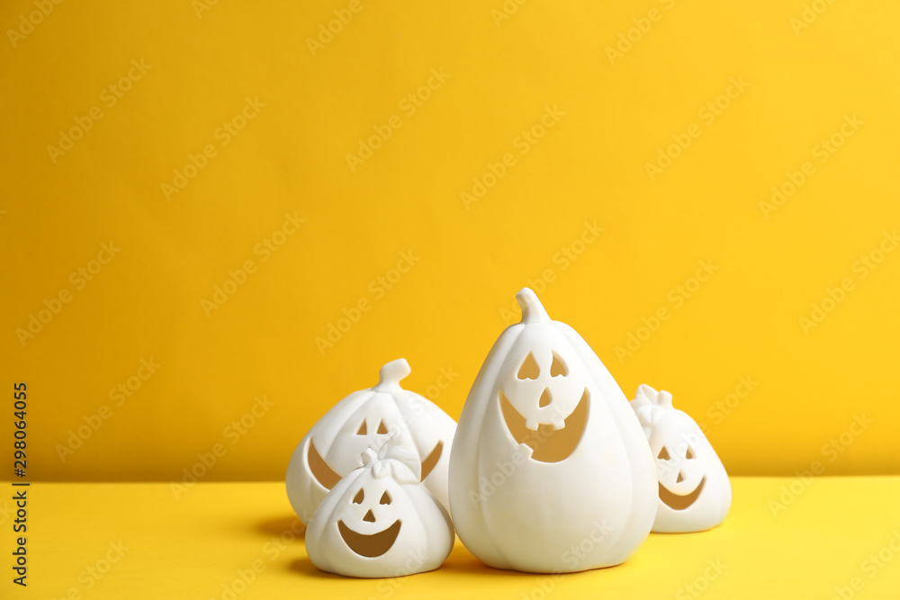Jack-o-Lantern candle holders on yellow background. Halloween decor Jack-o-Lantern candle holders on yellow background. Halloween decor