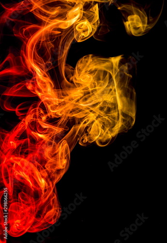 Colored smoke on black background © yauhenka