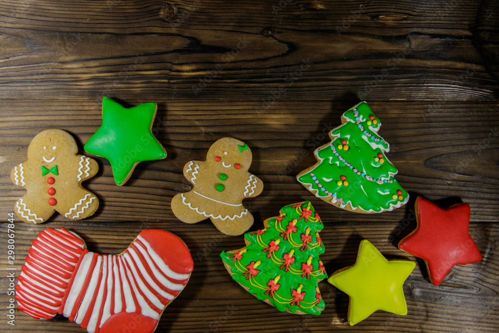 Tasty festive Christmas gingerbread cookies on wooden table. Top view