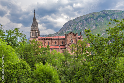 Covadonga  Spain. Basilica of the Holy Virgin Mary on a background of mountains
