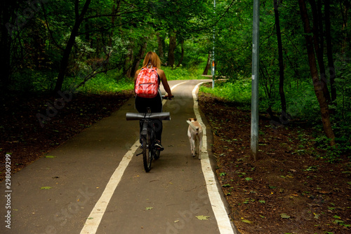 Sporty blonde in the Park on a bike