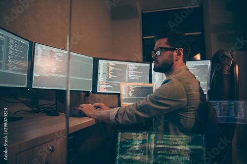 Obraz w ramie Photo of programmer serious writing code to software which will be involved into large projects connected with artificial intelligence analyzing time when the work may be finished
