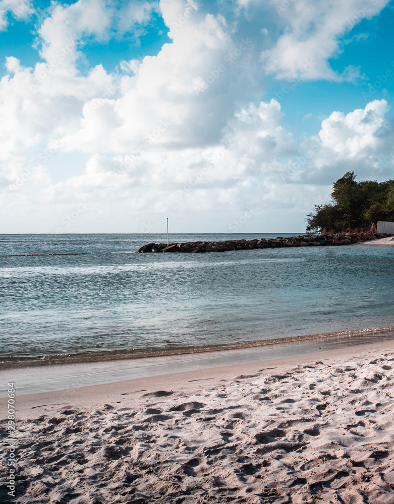 The sand the sky and the clear Caribbean waters