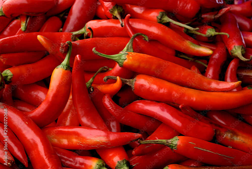 close up bright red chili peppers vegetable background or texture