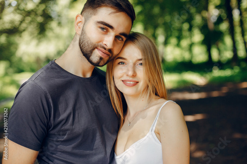 Couple in a forest. Beautiful blonde with her boyfriend