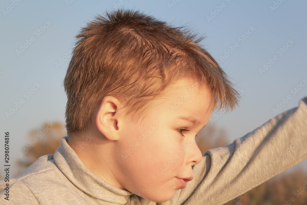Little boy child gestures playing on the beach Little boy child gestures playing on the beach