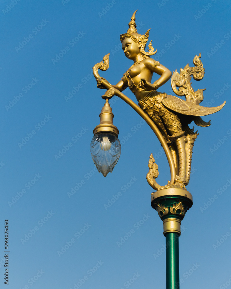 old thai street lamp on background of blue sky