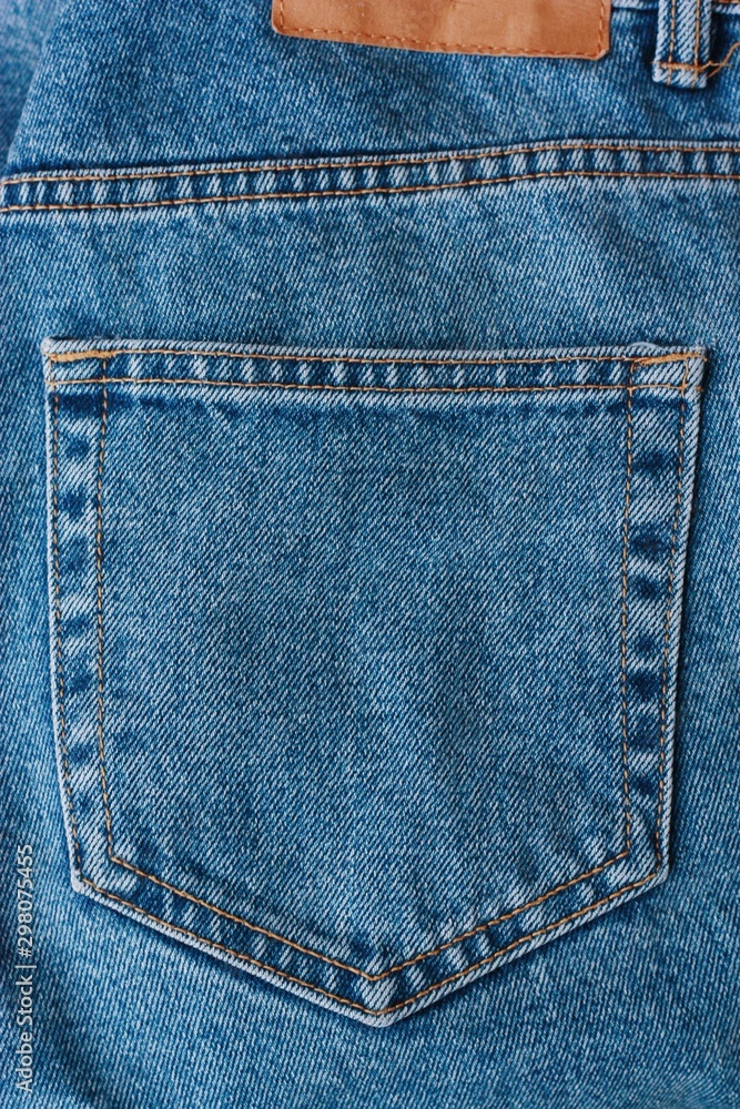 Beautiful textile blue jeans with pocket close up Beautiful textile blue jeans with pocket close up