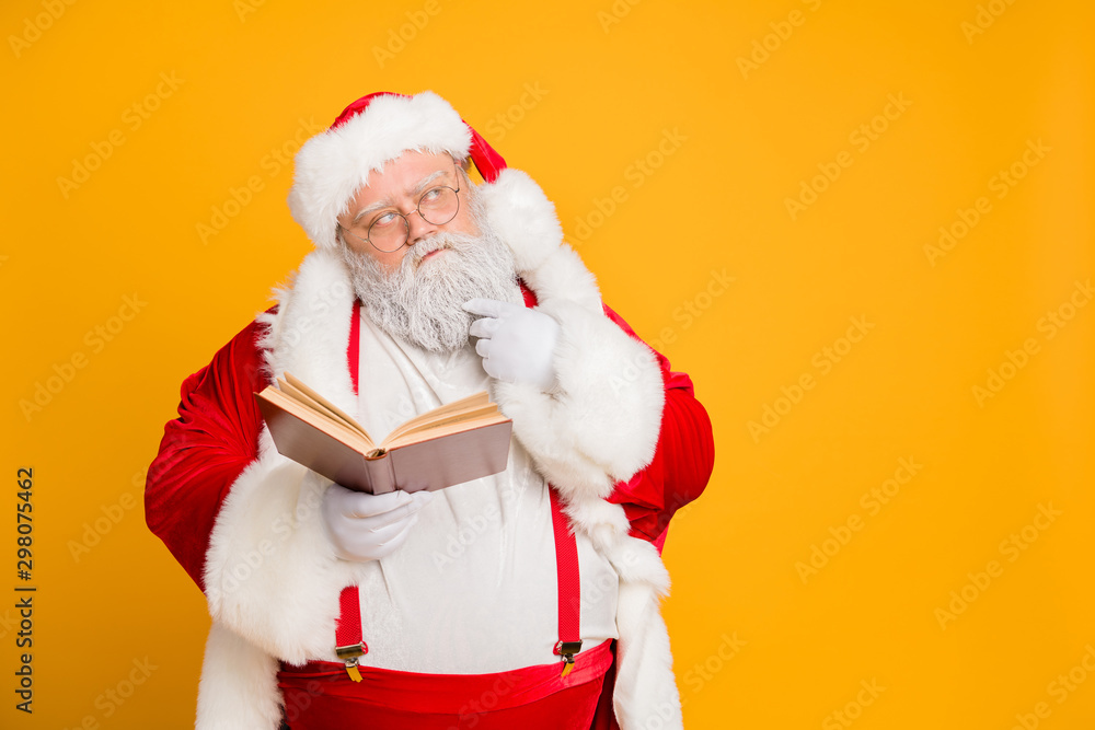 Who choose. Portrait of serious thoughtful santa claus hold paper 