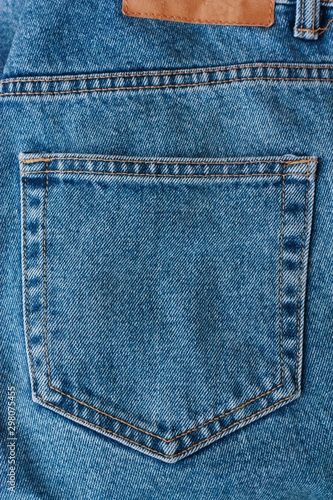 Beautiful textile blue jeans with pocket close up photo
