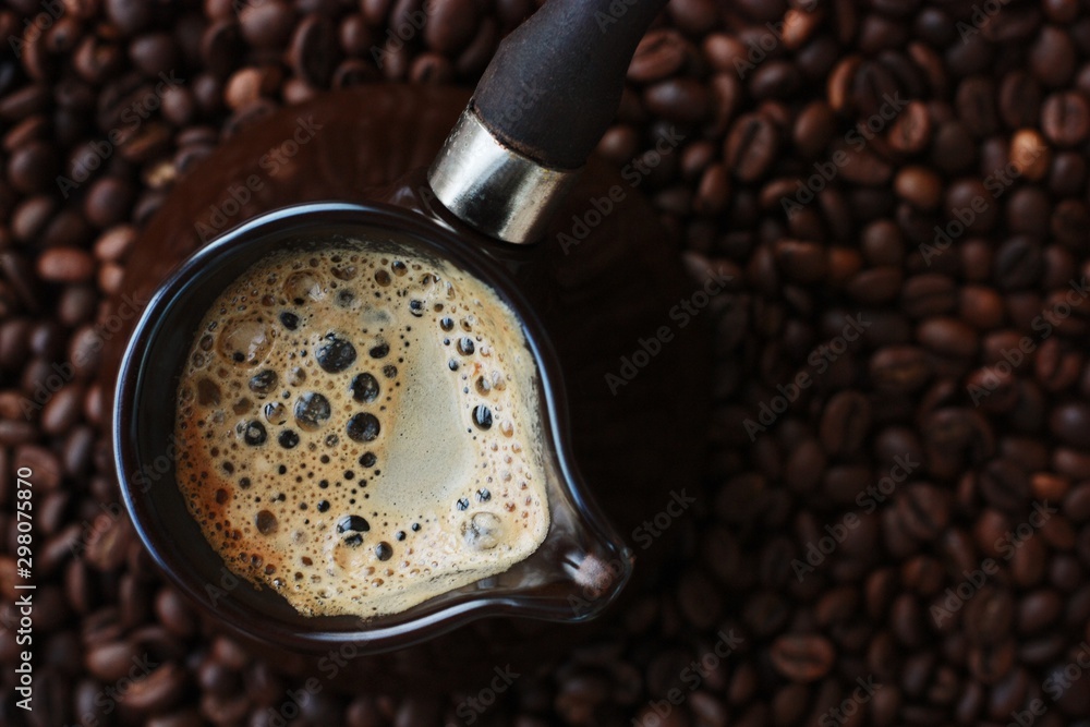 Fresh and tasty coffee in the Turka and coffee beans Stock Photo