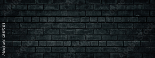 Black brick wall wide texture. Gloomy grunge panoramic dark background