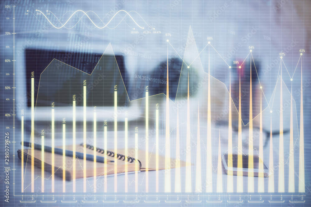 Stock market chart hologram drawn on personal computer background. Double exposure. Concept of investment. Stock market chart hologram drawn on personal computer background. Double exposure. Concept of investment.