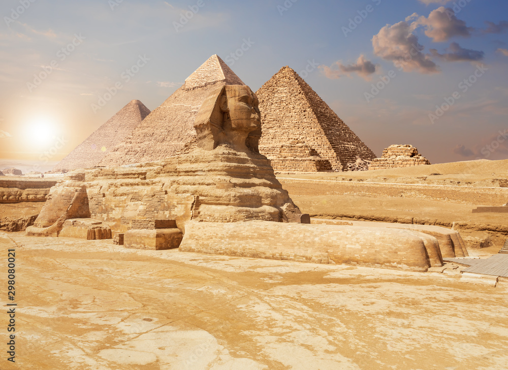 Famous Giza Sphinx and the Pyramids on the background, Egyptian desert