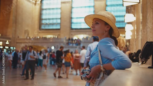 Young tourist with a retro camera in the Central Grand Terminal