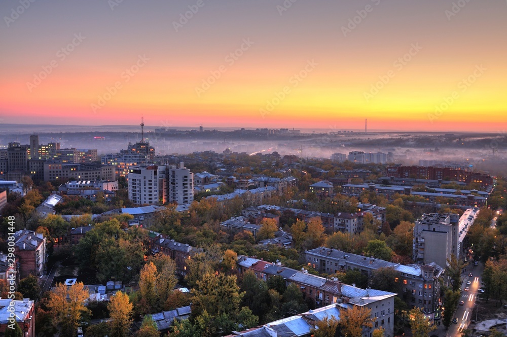 Fototapeta premium Aerial view of sun rises over summer European city