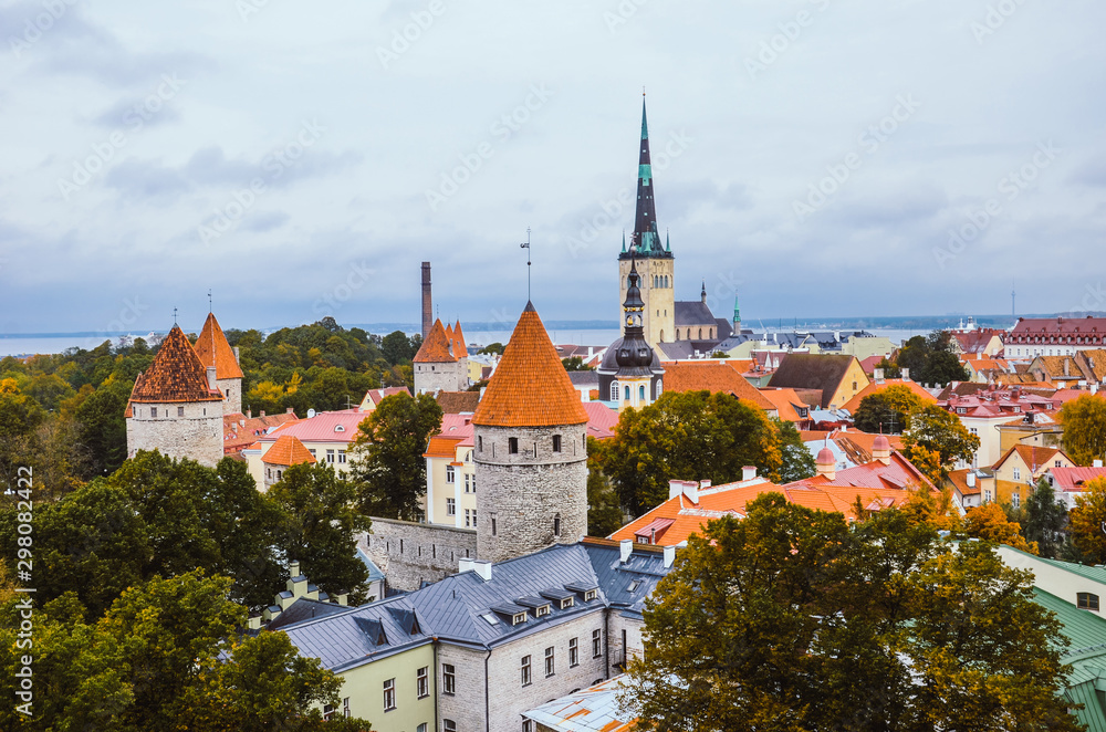 Amazing skyline of Tallinn, the capital of Estonia, with dominant St. Olaf's Church, a Baptist church. The historical old town with the Walls of Tallinn, remnants of medieval defensive walls