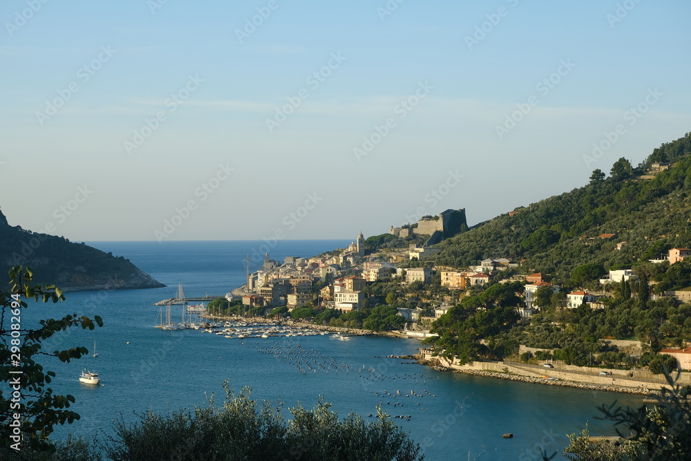 Panorama from the top of Portovenere, near the Cinque Terre, at sunrise light. The bay with the marina, the fort, the church of San Pietro.