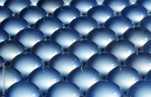 Close-up large steel balls lie next to each other