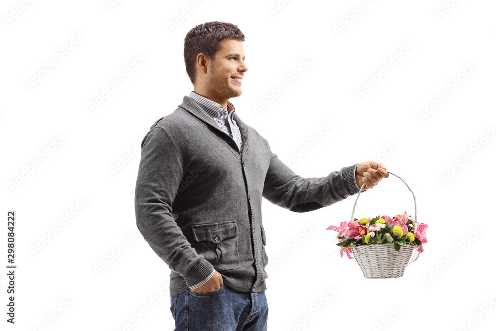 Young man standing with a basket full of flowers Young man standing with a basket full of flowers
