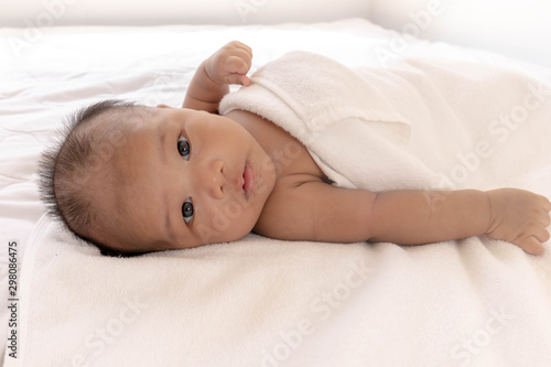 Newborn babies sleep on their back Was playing on the white mattress in a good mood During bedtime, the child's brain will work. To enhance Memory-boosting and learning-building skills