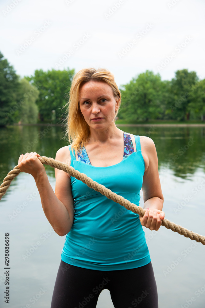 A strong woman with a rope in her hands