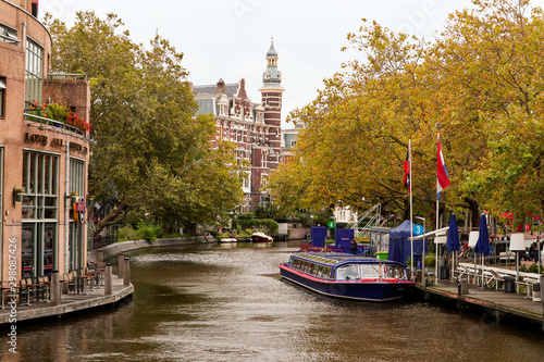 Canvas Print Amsterdam Canal with boat on the water