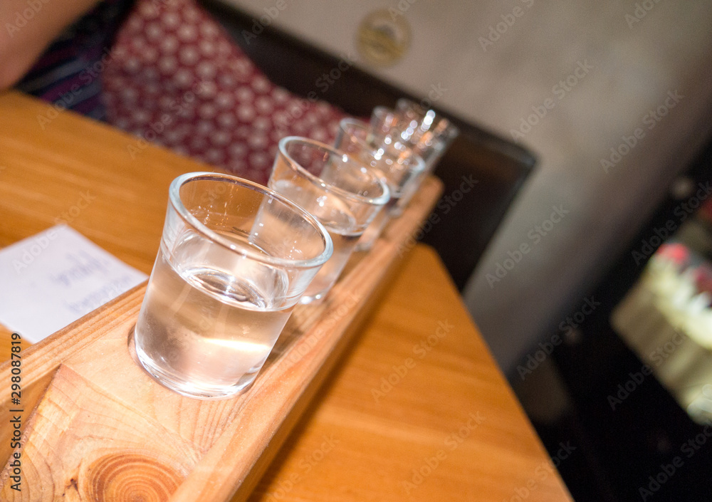 some shot alcoholic drinks on a stand some shot alcoholic drinks on a stand
