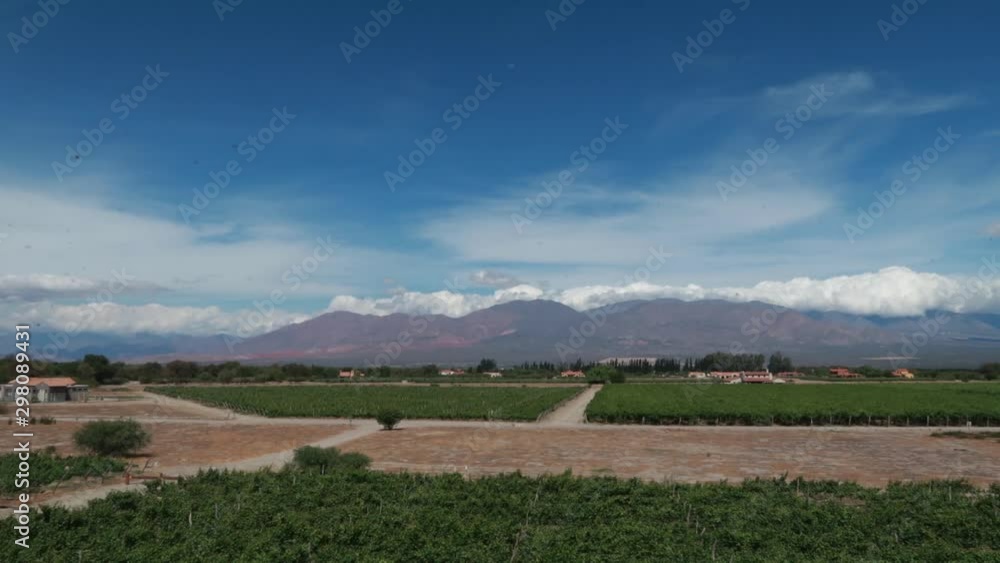 Timelapse of Clouds Rolling Over Mountains With Farm in Foreground In Argentina Timelapse of Clouds Rolling Over Mountains With Farm in Foreground In Argentina