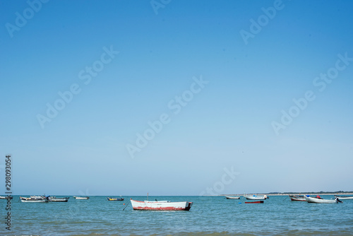 Little boats on the sea. Daylight and blue water.