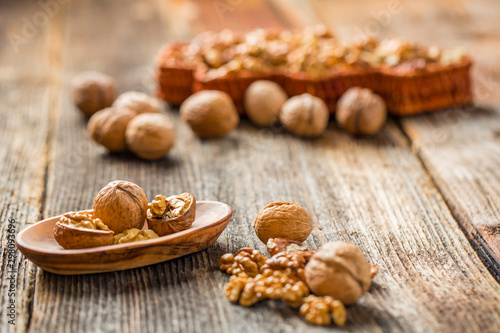 Handful of Walnuts on wooden background