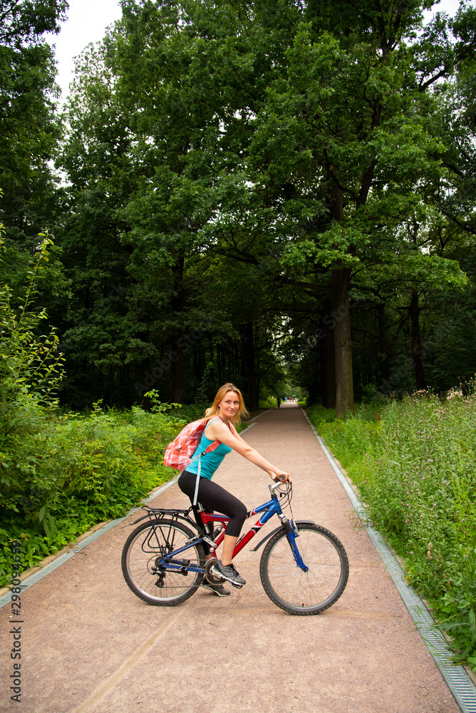 Beautiful girl on a bike in the Park Beautiful girl on a bike in the Park