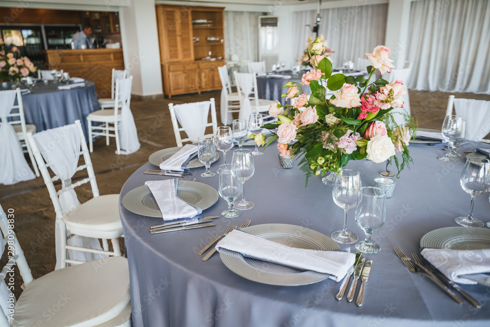 Fototapeta premium Luxury wedding table decoration. Special event table set up. Fresh flower decoration. Pastel colors - blue and pink decoration