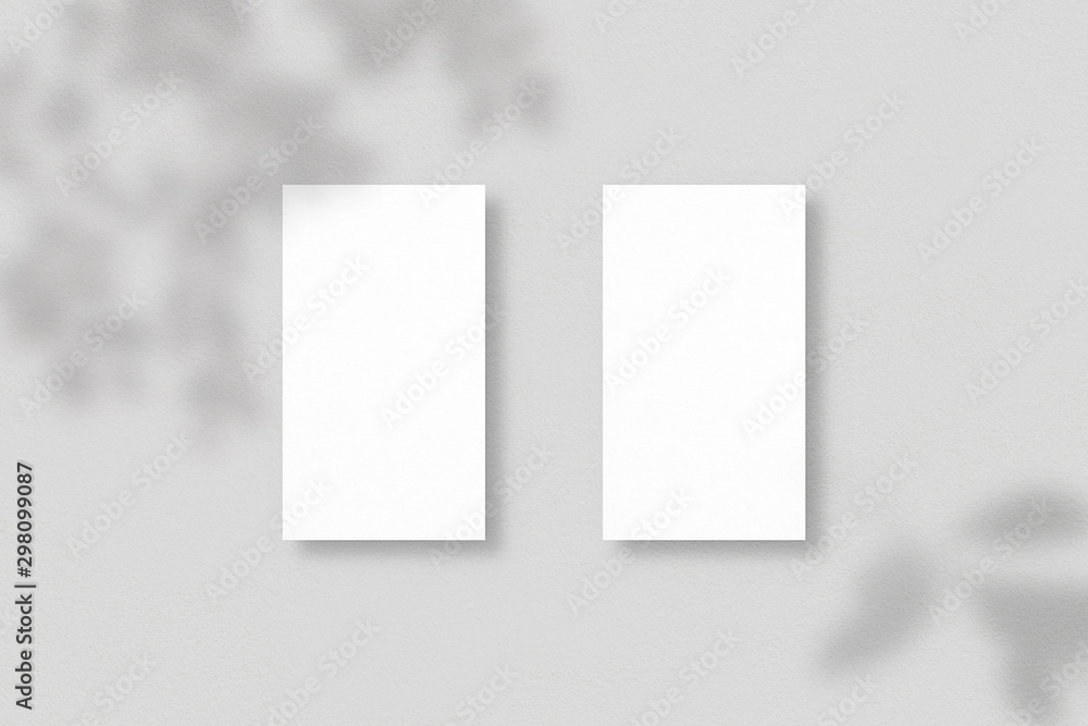 Blank business cards on grey background. Mockup of two vertical business cards with soft shadows. Template for branding identity. Photo mockup with clipping path. Blank business cards on grey background. Mockup of two vertical business cards with soft shadows. Template for branding identity. Photo mockup with clipping path.