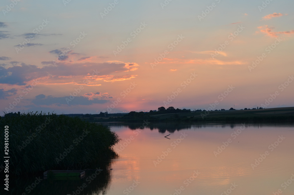 Sunset grass on river sunset landscape