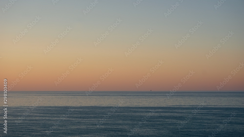 Sunset over Adriatic sea with mining platform in the distance