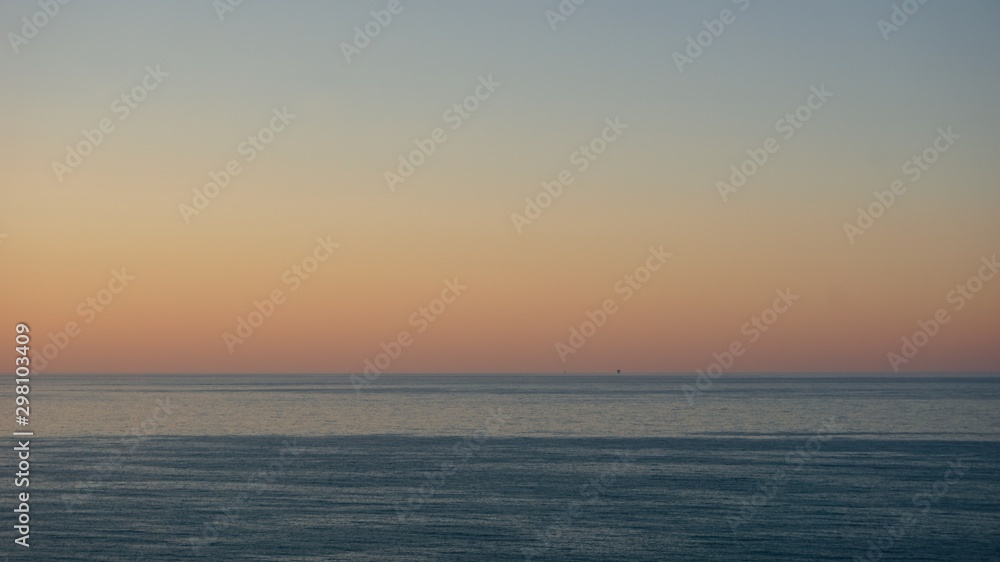 Sunset over Adriatic sea with mining platform in the distance Sunset over Adriatic sea with mining platform in the distance
