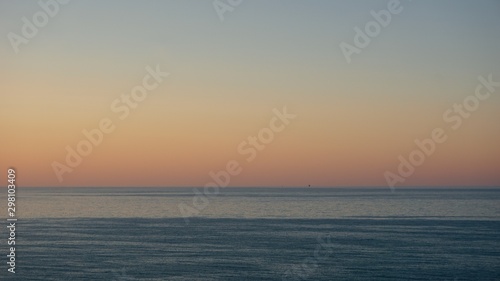 Sunset over Adriatic sea with mining platform in the distance
