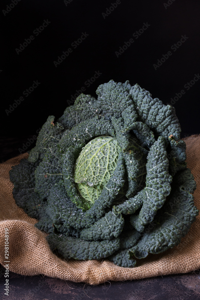 Cabbage on drark rustic background