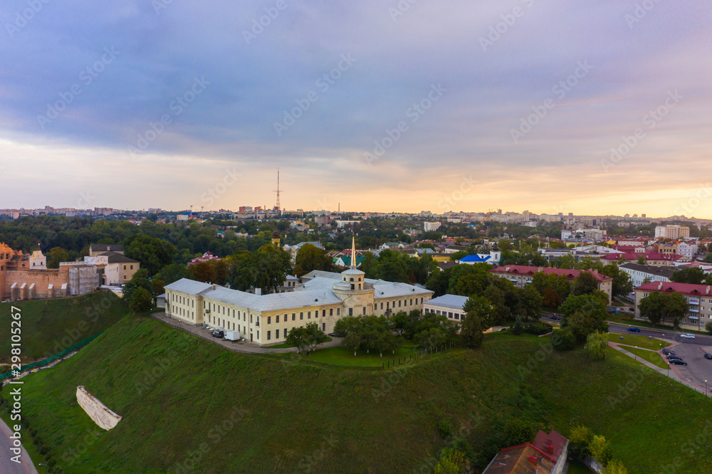 New Castle on high river bank of Neman in Grodno in sunset light, Aerial view from a drone., Belarus