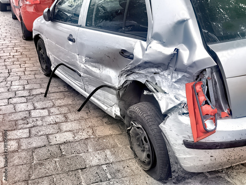 damaged automobile after collision in city
