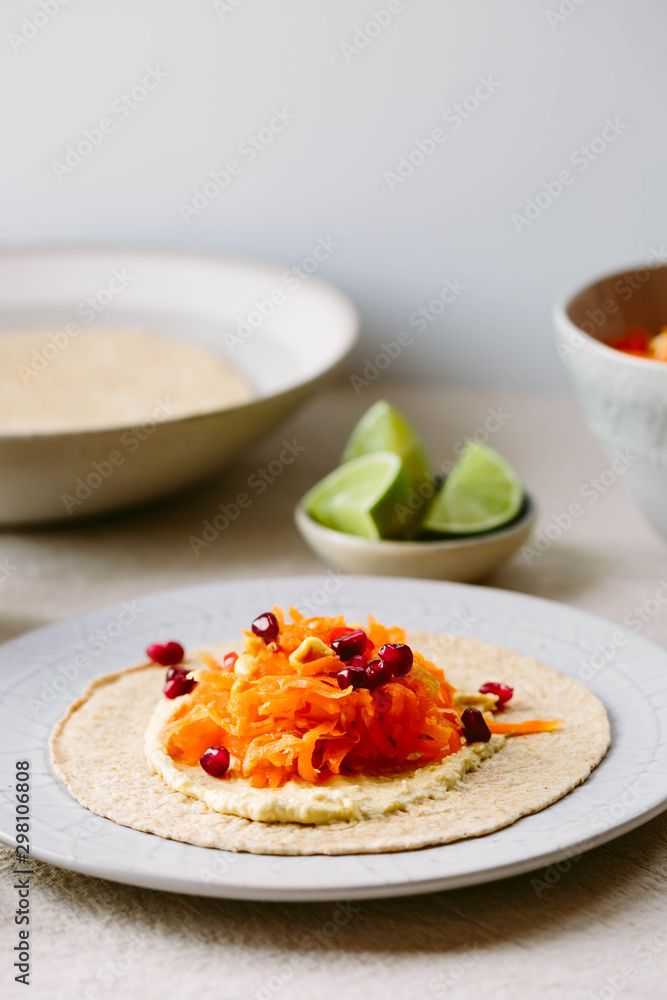 Carrot and hummus wraps. Carrot and hummus wraps.