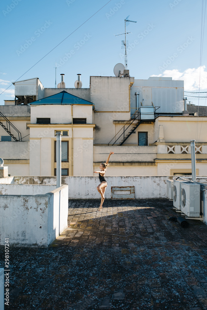 Young ballerina dancing on roof Young ballerina dancing on roof