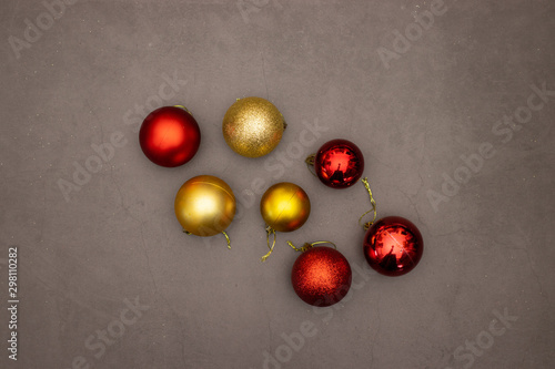 Gold and red Christmas balls on the table 