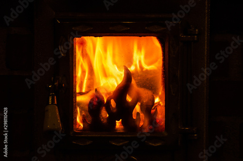 Wood burning inside the fireplace - traditional winter heating