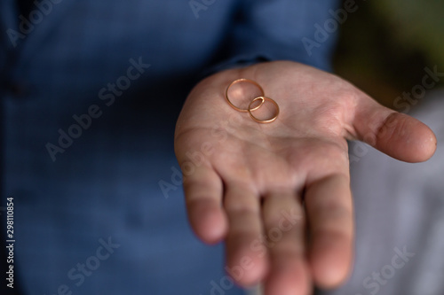 man's hand with wedding rings